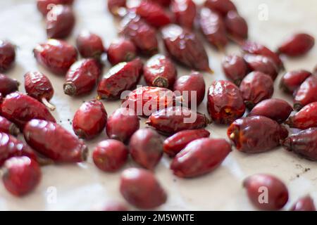 Dried rose hips. Red fruits rosehip with vitamins. Preparation of plant decoction for health drink. Healing herb. Photo close up Stock Photo