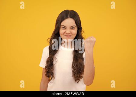 Child girl with angry expression. 12, 13, 14 year old teenager with angry face, upset emotions. Stock Photo