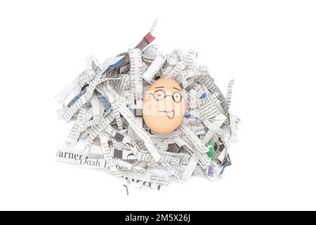 egg face glasses on newspapers recycle. Stock Photo