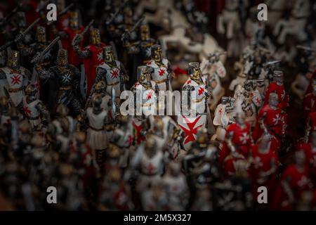 Maltese soldiers in toy size. Collection of toy soldiers with maltese cross on them, in white red and black color. Stock Photo