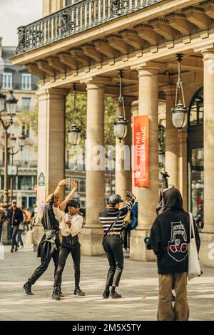 A vertical shot of a group having a performance during daytime in Paris, France Stock Photo