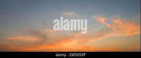 Fiery dramatic sunset, colorful clouds in the sky Stock Photo