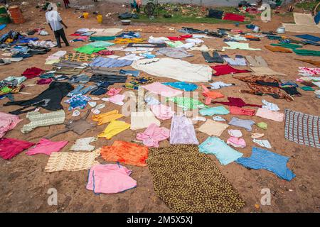 Clothes dry in the sun on ground in traditional manner in Segou , Mali , West Africa Stock Photo