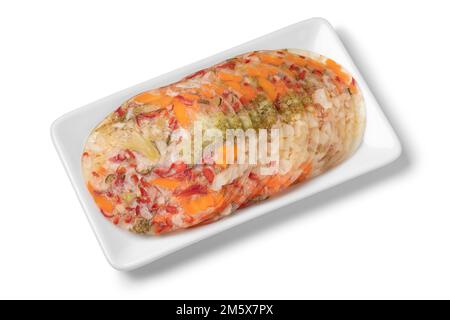 Dish with colorful delicious slices of vegetables in aspic close up isolated on white background Stock Photo