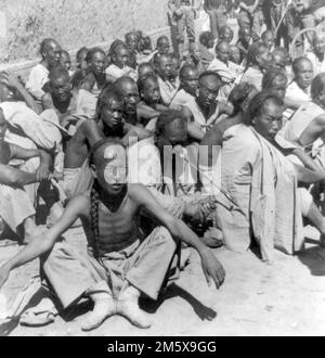 Boxer Rebellion. Boxer prisoners captured and brought in by 6th U.S. Cavalry, Tientsin, China. Photo by Underwood and Underwood, 1900 Stock Photo