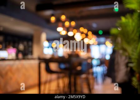 Blurred background of restaurant with bokeh lights Stock Photo