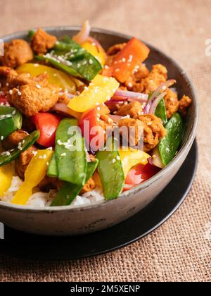 Vegetable Stir-fry with TVP pieces on rice Stock Photo