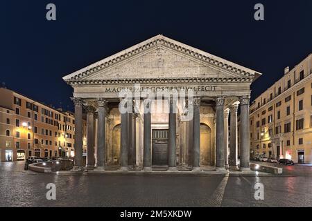 The Pantheon in Rome as well as the surrounding square at night time Stock Photo