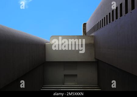A view from below, offset cement and concrete high rise building bottom up view Stock Photo