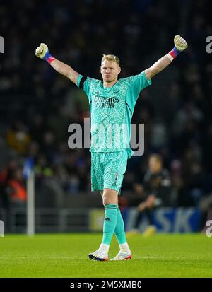 Arsenal goalkeeper Aaron Ramsdale celebrates after team-mate Martin Odegaard (not pictured) scores their side's second goal of the game during the Premier League match at the American Express Community Stadium, Brighton. Picture date: Saturday December 31, 2022. Stock Photo