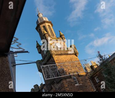 Forres, Moray, UK. 31st Dec, 2022. This shows the last of the sun hitting the high points and Tolbooth Clck Tower in the High Street. Credit: JASPERIMAGE/Alamy Live News Stock Photo