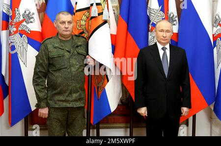 Rostov-on-Don, Russia. 31st Dec, 2022. Russian President Vladimir Putin presents soldiers with the 1st Donetsk Army Corps, 2nd Lugansk-Severodonetsk Army Corps, Donetsk Higher Combined Arms Command School with banners during a ceremony at the Southern Military District headquarters, December 31, 2022 in Rostov-on-Don, Russia. Putin presented awards and delivered his New Year address during the visit. Credit: Mikhail Klimentyev/Kremlin Pool/Alamy Live News Stock Photo