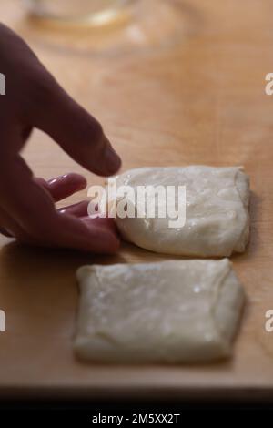 kneading pancakes by hand, handmade morocco fritters Stock Photo