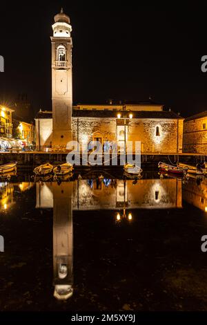 lazise harbor at night with light decoration at new year's eve Stock Photo