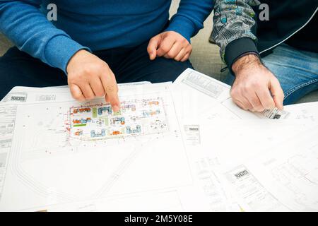 Partners working at building project on the office table Stock Photo