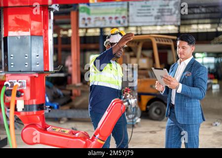 Engineer customer service explain introduction of new design robotic ...