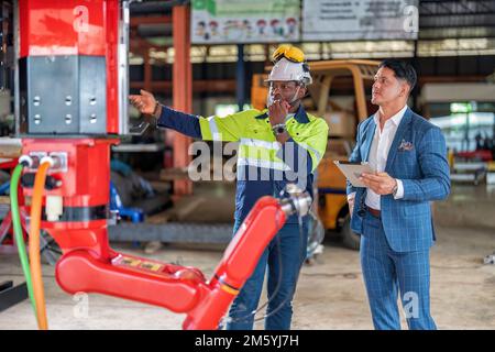 Engineer customer service explain introduction of new design robotic ...