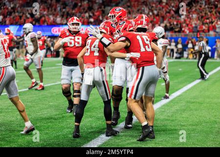 Indianapolis, United States. 10th Jan, 2022. Georgia Bulldogs tight end Brock  Bowers (19) celebrates a touchdown with his teammates, running back James  Cook (4) and wide receiver Ladd McConkey (84) during the