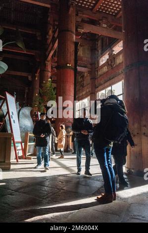 Nara, Japan - January 5, 2020. Visitors experiencing the Todai-ji Temple in Nara. This temple is famous for its giant Buddha statue and a popular tourist destination. Stock Photo