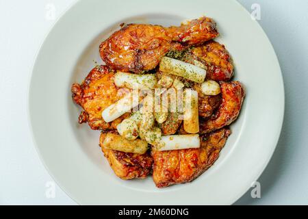 yangnyeom chicken, Korean Seasoned Fried Chicken : This dish is seasoned chicken cut into pieces, deep- fried, and mixed with soy sauce, gochujang, or Stock Photo