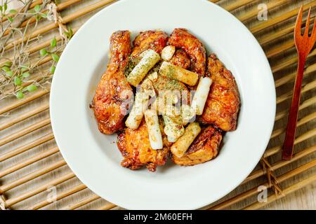 yangnyeom chicken, Korean Seasoned Fried Chicken : This dish is seasoned chicken cut into pieces, deep- fried, and mixed with soy sauce, gochujang, or Stock Photo