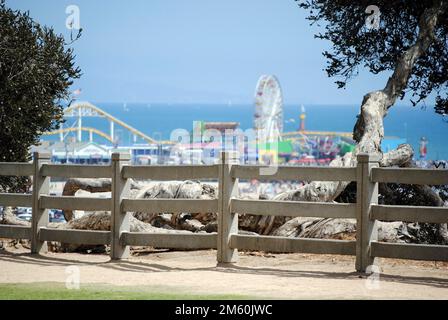 View of Santa Monica pier, Ferris wheel and other attractions from Ocean Avenue, Calirfornia Stock Photo