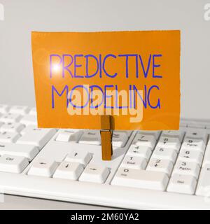 Conceptual caption Predictive Modeling. Word Written on maintenance strategy driven by predictive analytics Stock Photo
