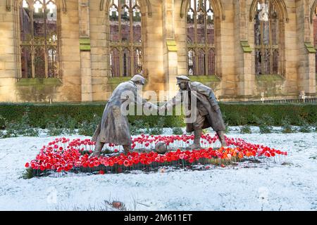 Liverpool, UK:  Christmas truce statue by Andy Edwards, titled 'All Together Now', outside Saint Luke's bombed-out Church. Stock Photo