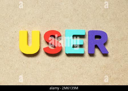 Color alphabet letter in word user on wood background Stock Photo