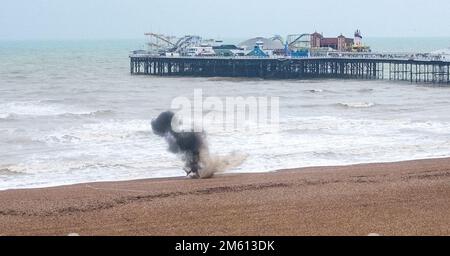 Brighton UK 1st January 2023 - A WW2 shell washed up on beach near the Brighton Palace Pier is blown up by the Royal Navy Bomb Disposal team after the beach was evacuated : Credit Simon Dack / Alamy Live News Stock Photo