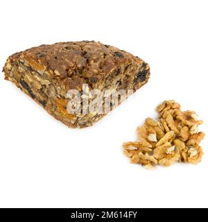 Bread with nuts, seeds and dried fruits isolated on white background. walnut isolated on white background. Stock Photo