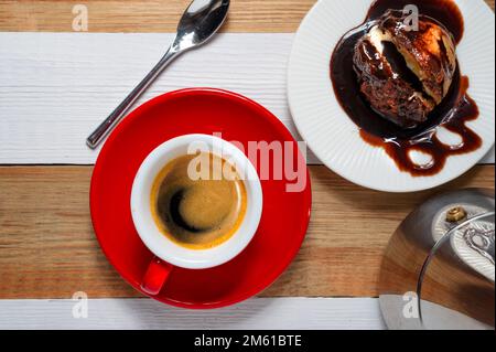 Profiteroles and espresso a top view shot Stock Photo