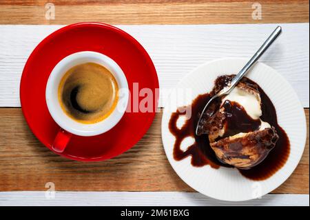 Profiteroles and espresso a top view shot Stock Photo