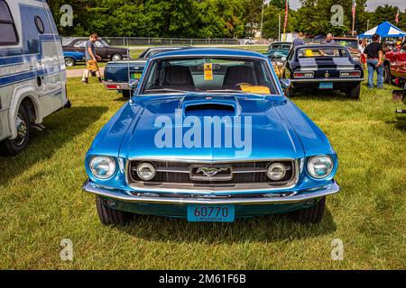 Iola, WI - July 07, 2022: High perspective front view of a 1967 Ford Mustang GT Fastback at a local car show. Stock Photo