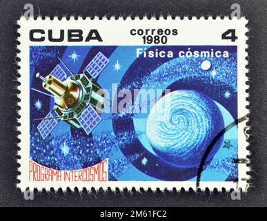 Cancelled postage stamp printed by Cuba, that shows Satellite and globe (Physics), Intercosmos Program, circa 1980. Stock Photo