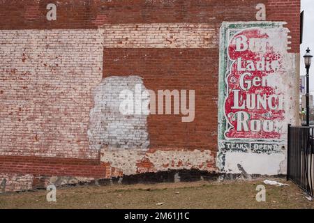 Ghost writing on a buildings brick wall Stock Photo