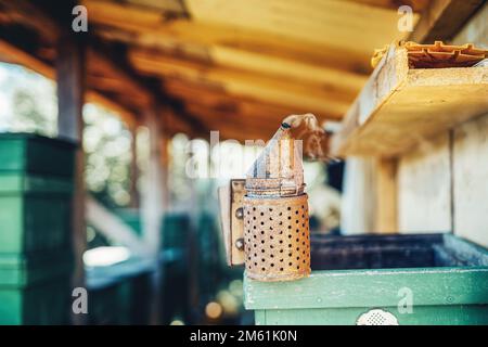 Smoke beekeeper for processing bees by smoke. Stock Photo