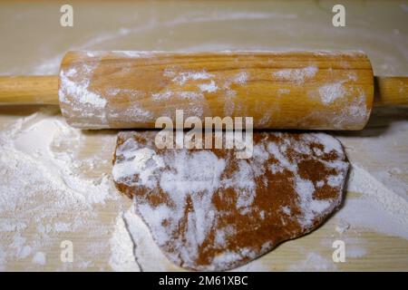 gingerbread dough roll on the table rolled out dough for making cookies. Stock Photo