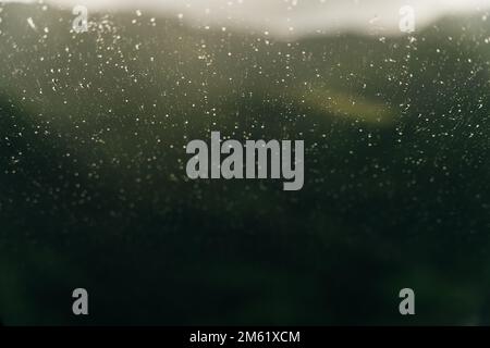 Raindrops on a back helicopter glass. On a cloudy, rainy day. High quality photo Stock Photo