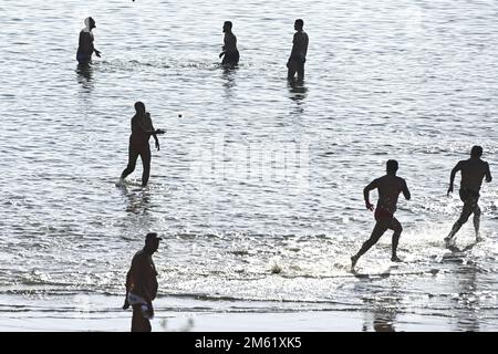 The people of Split used the sunny first day of the New Year for a picigin on Bacvice beach in Split, Croatia on January 1, 2023. Picigin is traditional ball game from Split  that is played on the beach. It is an amateur sport played in shallow water consisting of players keeping a small ball from touching the water. Stock Photo