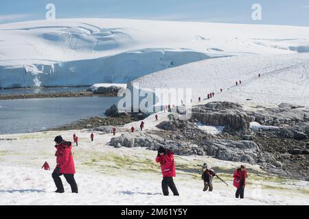 Tourists on shore at Portal Point in Antarctica Stock Photo