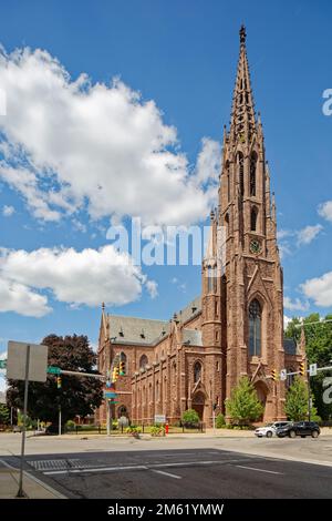 St. Louis Roman Catholic Church is the third to be built on the site. The church is known for its stained glass and open-work steeple with clock. Stock Photo