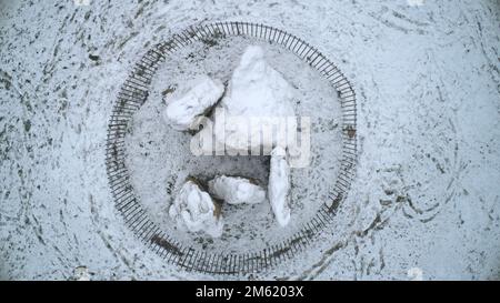 Vertical drone shot looking down upon the Whispering Knights Prehistoric monument at the Rollright Stones, Stock Photo