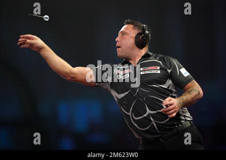 Gerwyn Price can be seen wearing ear defenders during his match against Gabriel Clemens on day fourteen of the Cazoo World Darts Championship at Alexandra Palace, London. Picture date: Sunday January 1, 2023. Stock Photo