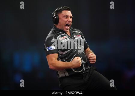 Gerwyn Price can be seen wearing ear defenders during his match against Gabriel Clemens on day fourteen of the Cazoo World Darts Championship at Alexandra Palace, London. Picture date: Sunday January 1, 2023. Stock Photo