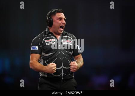 Gerwyn Price can be seen wearing ear defenders during his match against Gabriel Clemens on day fourteen of the Cazoo World Darts Championship at Alexandra Palace, London. Picture date: Sunday January 1, 2023. Stock Photo