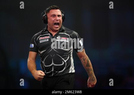 Gerwyn Price can be seen wearing ear defenders during his match against Gabriel Clemens on day fourteen of the Cazoo World Darts Championship at Alexandra Palace, London. Picture date: Sunday January 1, 2023. Stock Photo