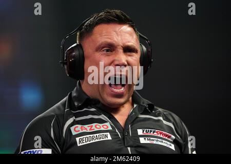 Gerwyn Price can be seen wearing ear defenders during his match against Gabriel Clemens on day fourteen of the Cazoo World Darts Championship at Alexandra Palace, London. Picture date: Sunday January 1, 2023. Stock Photo