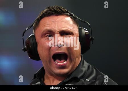 Gerwyn Price can be seen wearing ear defenders during his match against Gabriel Clemens on day fourteen of the Cazoo World Darts Championship at Alexandra Palace, London. Picture date: Sunday January 1, 2023. Stock Photo