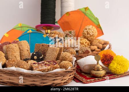 Indian Winter Delicacy viz. Tilgul, Til Mithai, Gajak, Chikki, Tilkut, Patang, Firki And Peanuts. Harvest Festival Makar Sankranti, Lohri, Uttarayan, Stock Photo